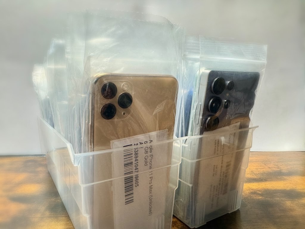 Graded devices bagged and labeled in storage bins